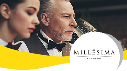 mujer y hombre catando vino con logo de Millésima
